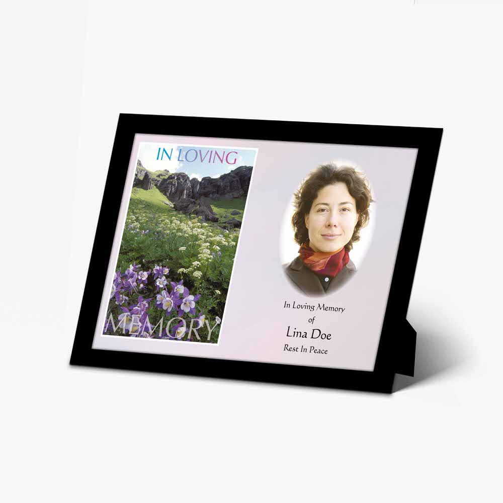 a memorial photo frame with a photo of a woman in a field of flowers
