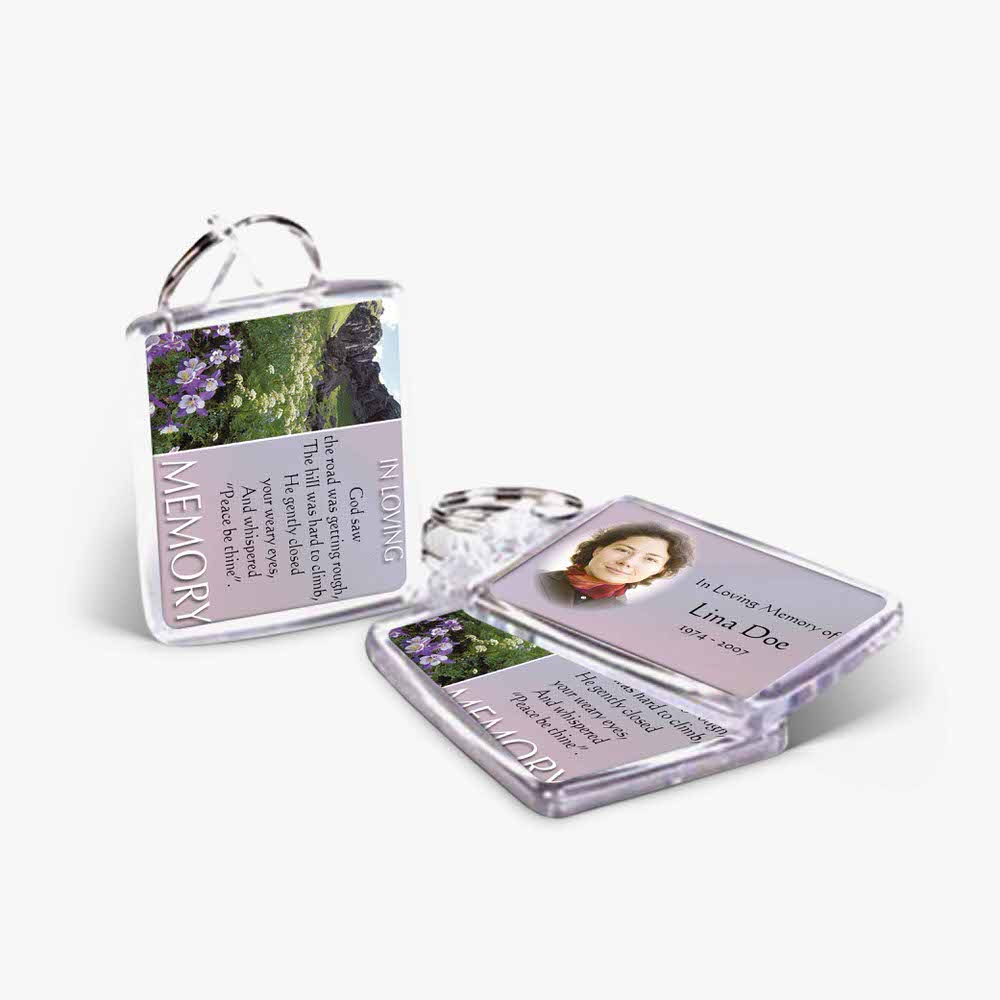 a key chain with a picture of a woman and a flower