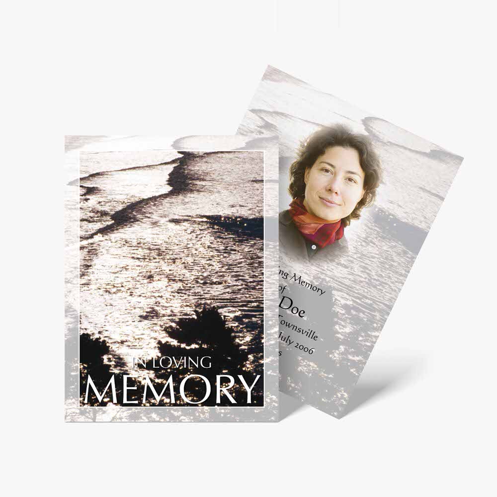 a memorial card with a photo of a woman on it