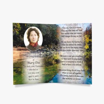 a beautiful memorial card with a photo of a river and a waterfall