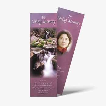 a bookmark with a photo of a waterfall and a woman's face