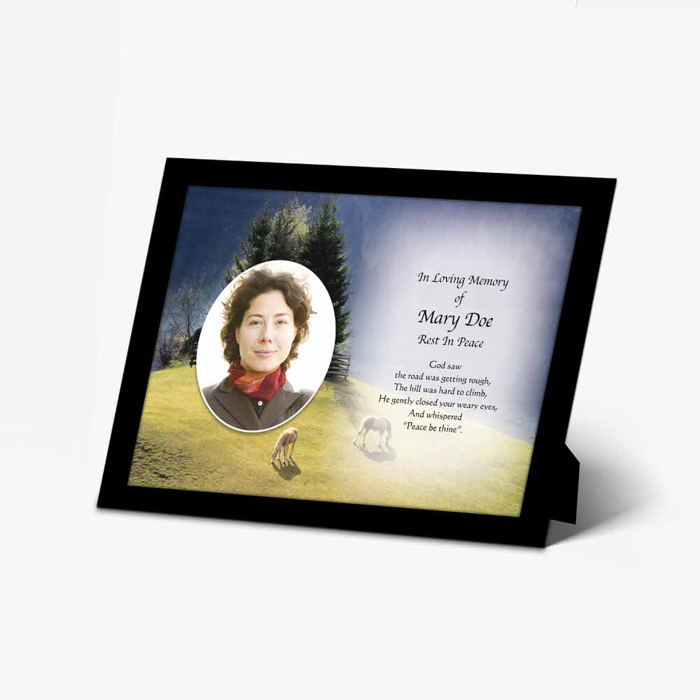 a memorial photo frame with a photo of a woman in a field
