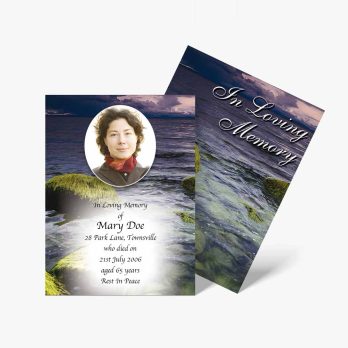 a funeral card with a photo of a woman on the rocks