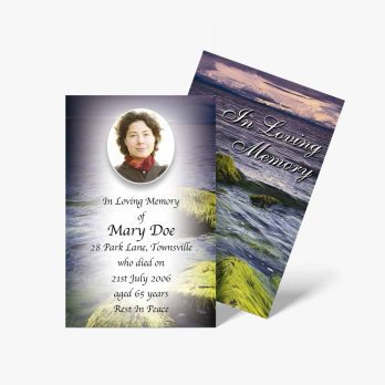 a funeral card with a photo of a woman on the beach