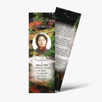 a funeral bookmark with a photo of a woman in the forest