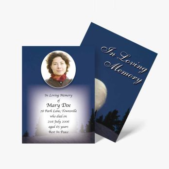 a funeral card with a photo of a woman in the woods