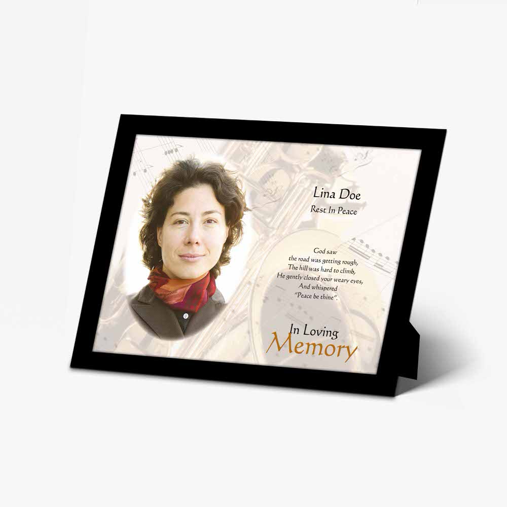 a memorial photo frame with a woman's face on it