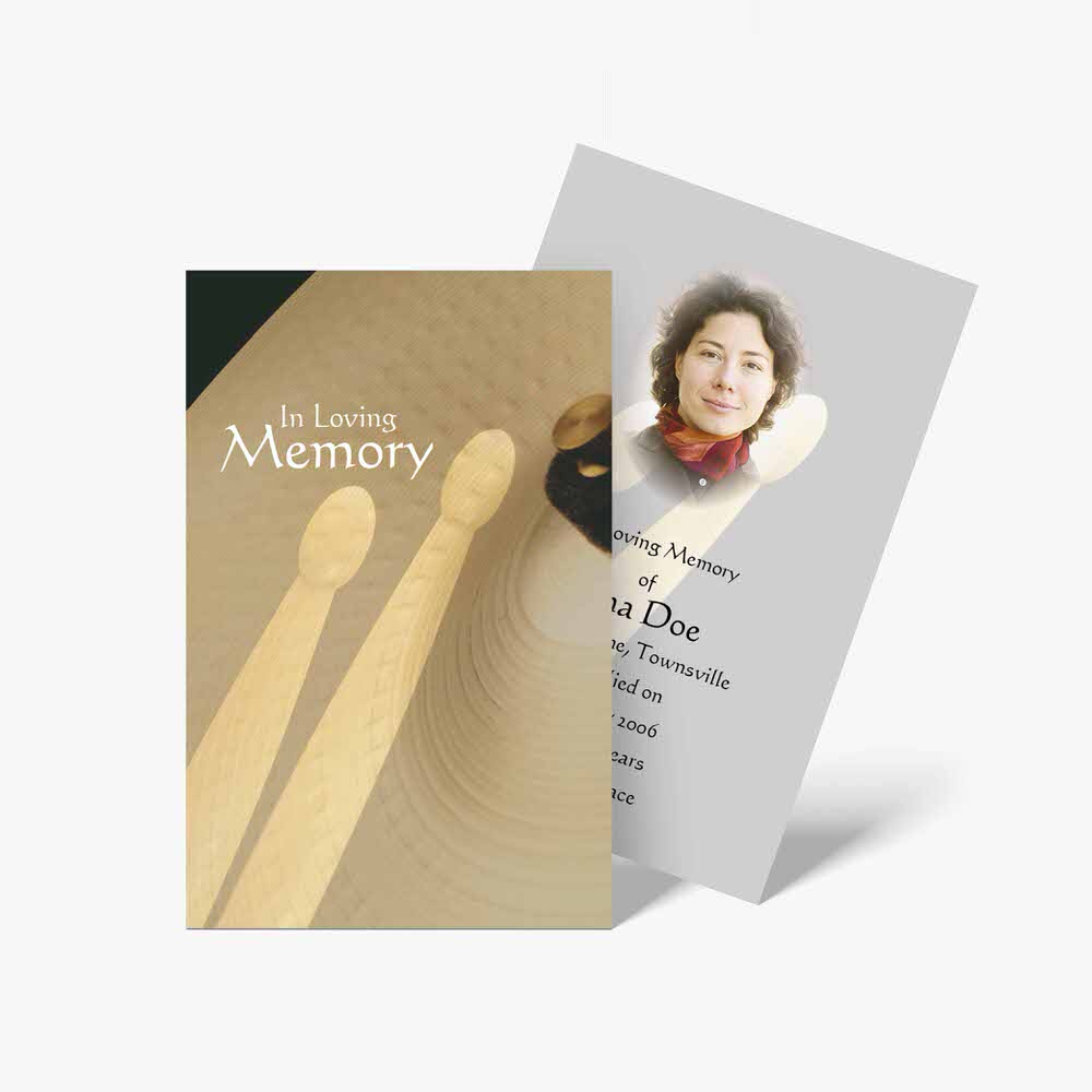 memorial cards with a photo of a person and a drum