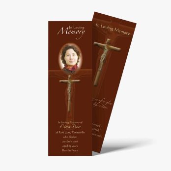 a brown bookmark with a cross on it