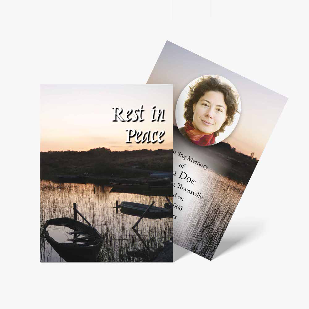 a funeral program template with a boat and a sunset