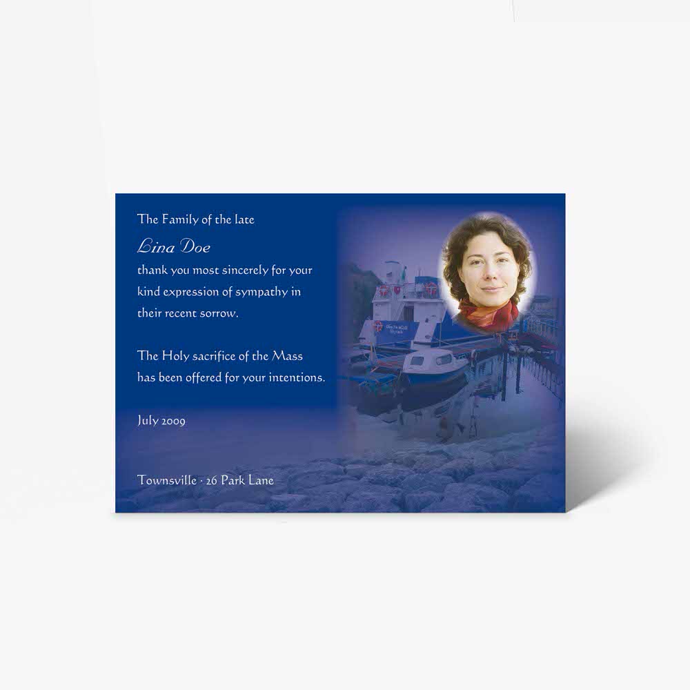 a blue card with a photo of a woman on a boat