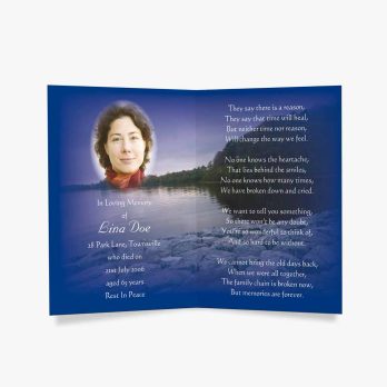 a blue memorial card with a photo of a woman in a lake