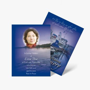 a blue funeral card with a photo of a woman on it