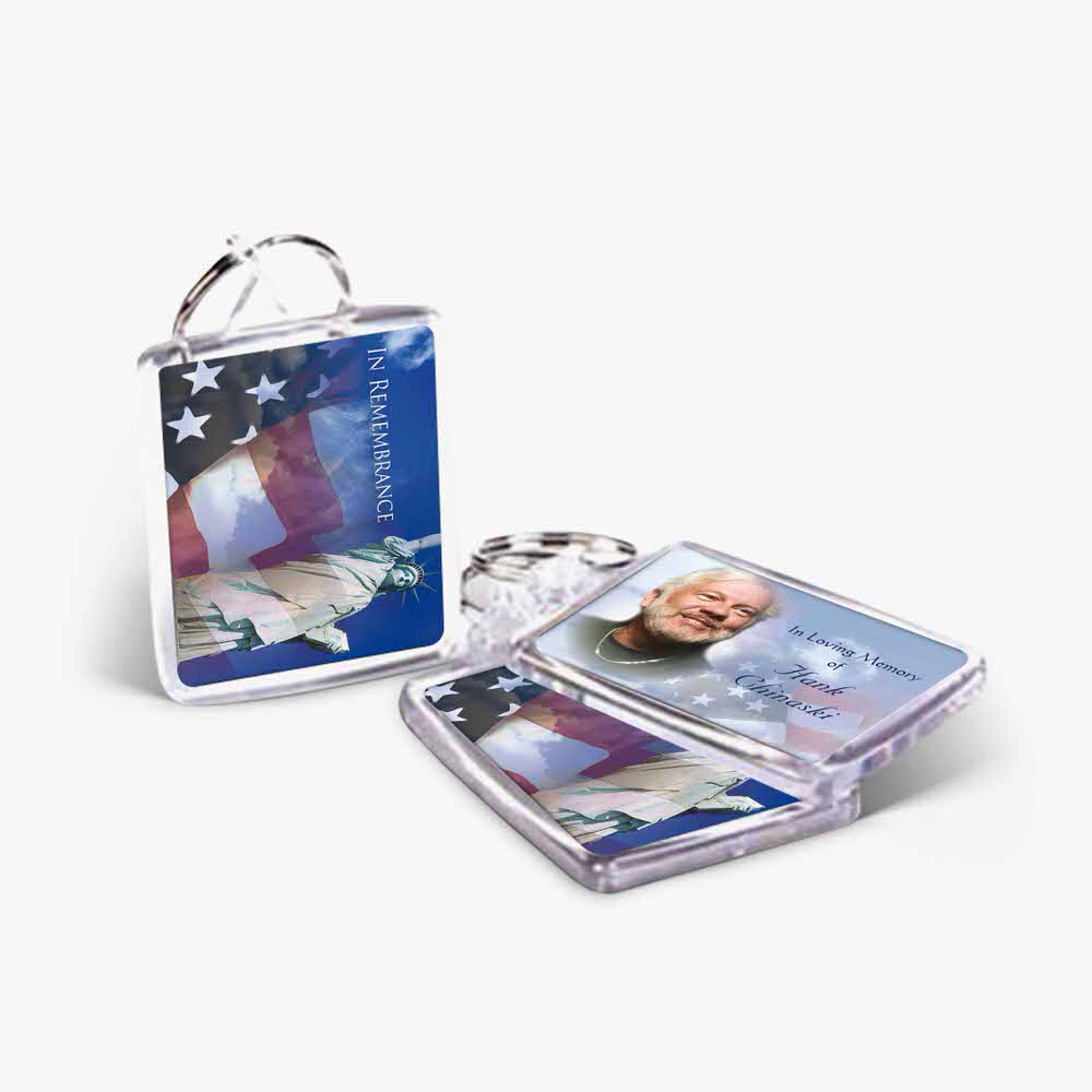 a key chain with an american flag and a picture of a man