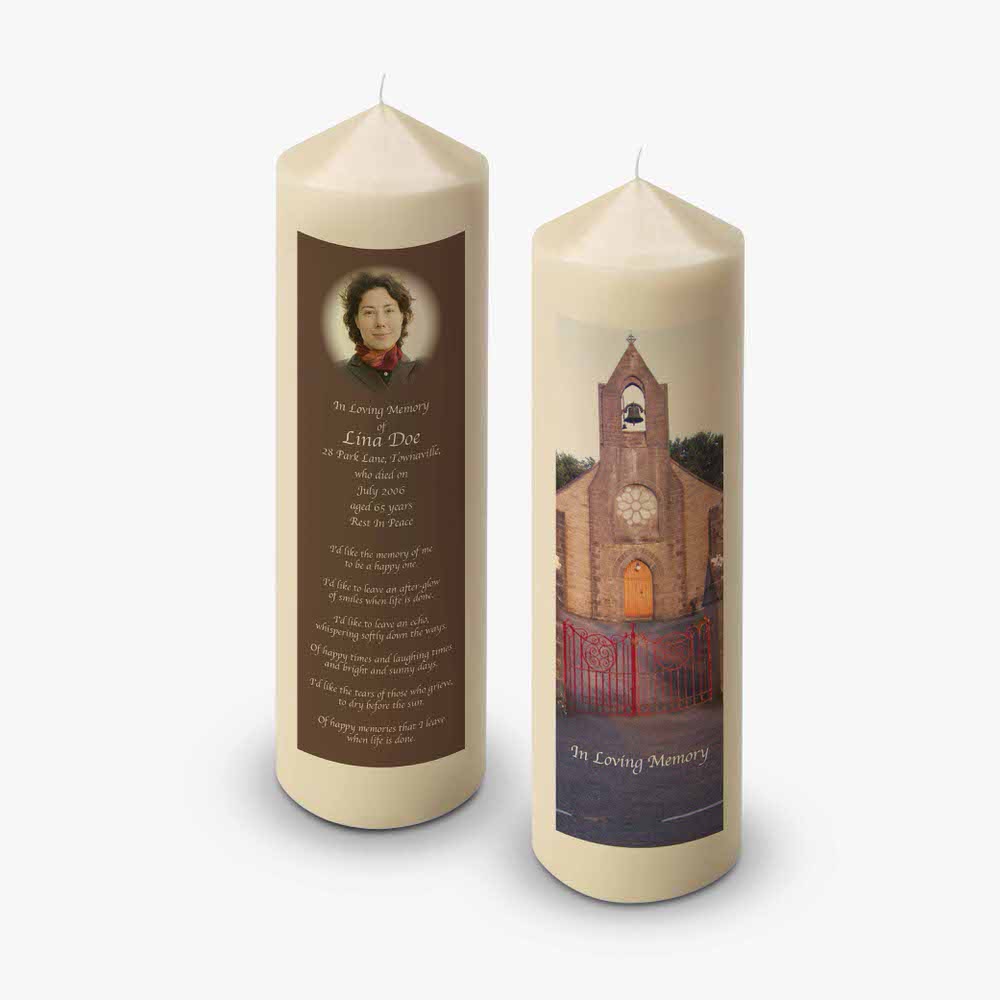 a candle with a photo of a church on it