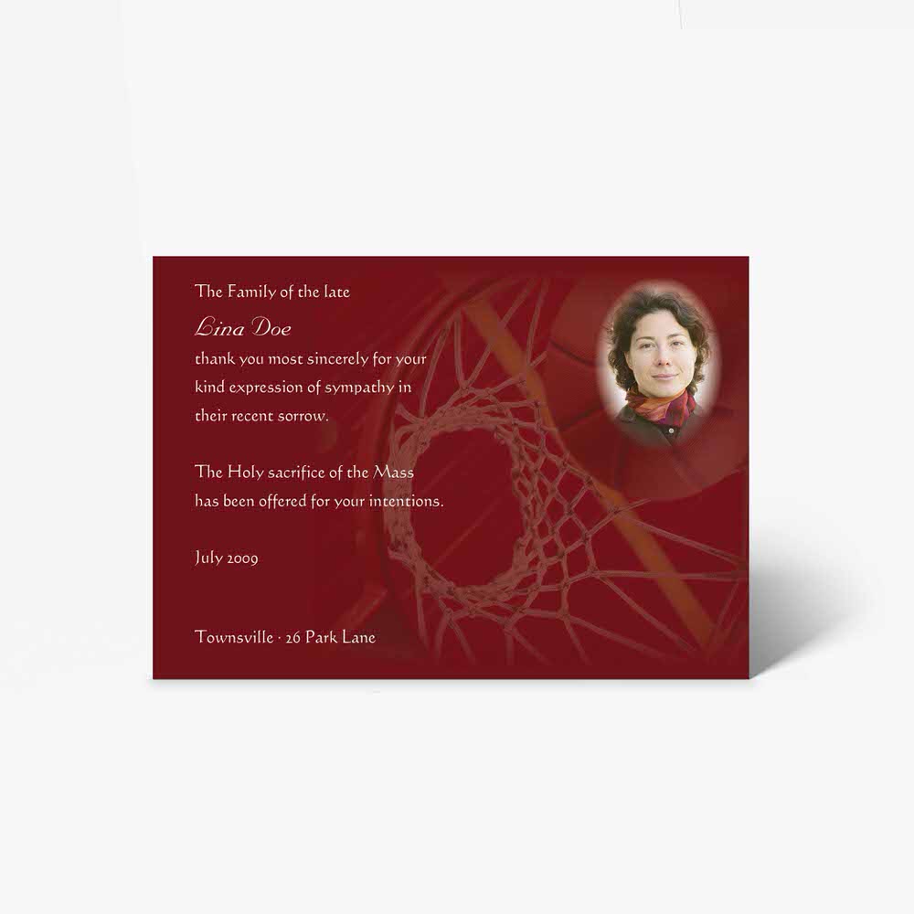 a red and gold funeral card with a photo of a woman