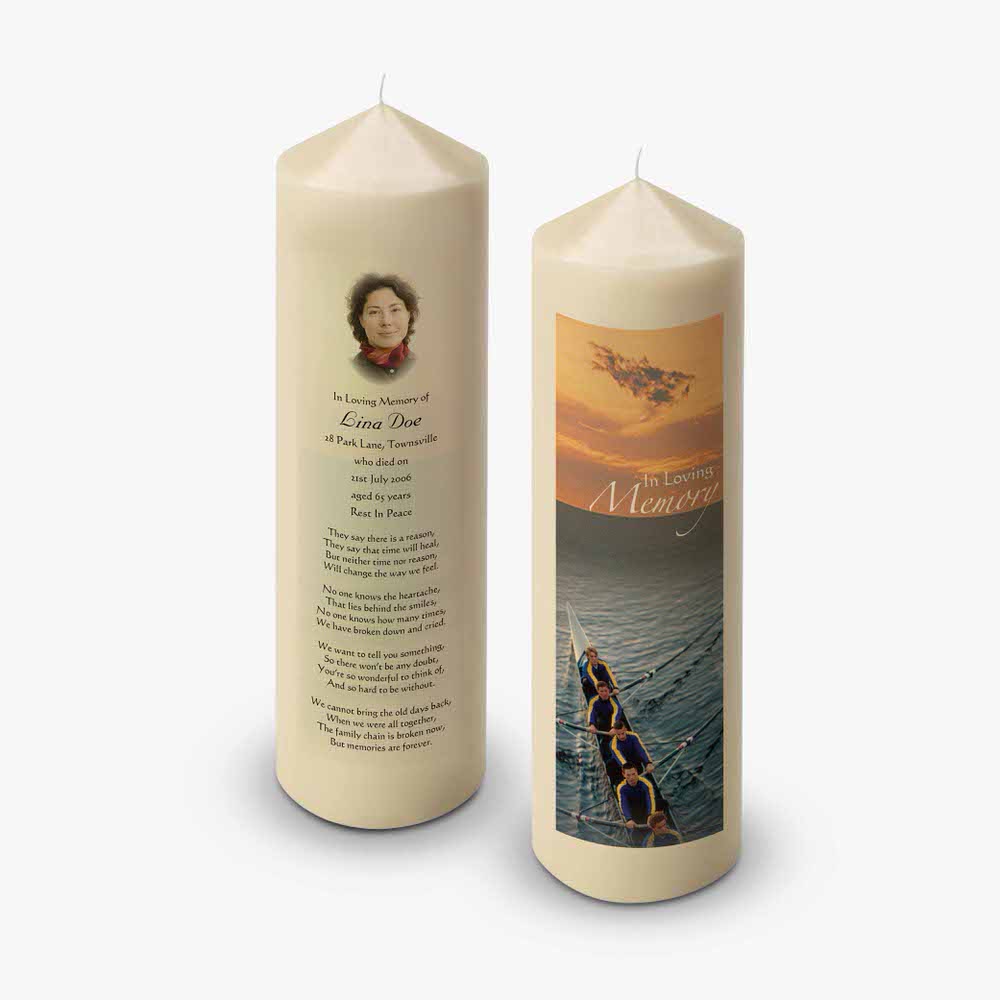 a candle with a picture of a boat on it