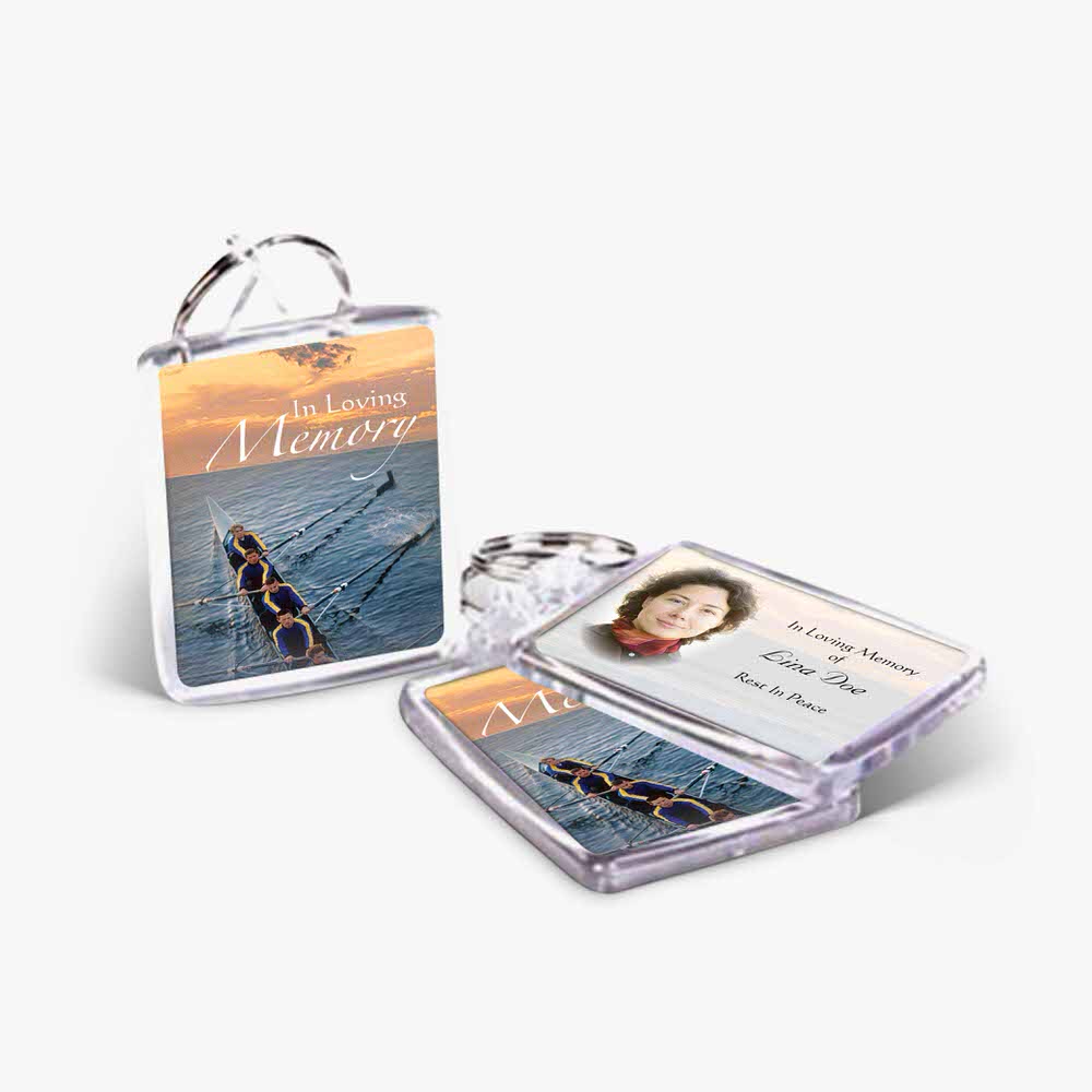 a photo card and key chain with a photo of a boat
