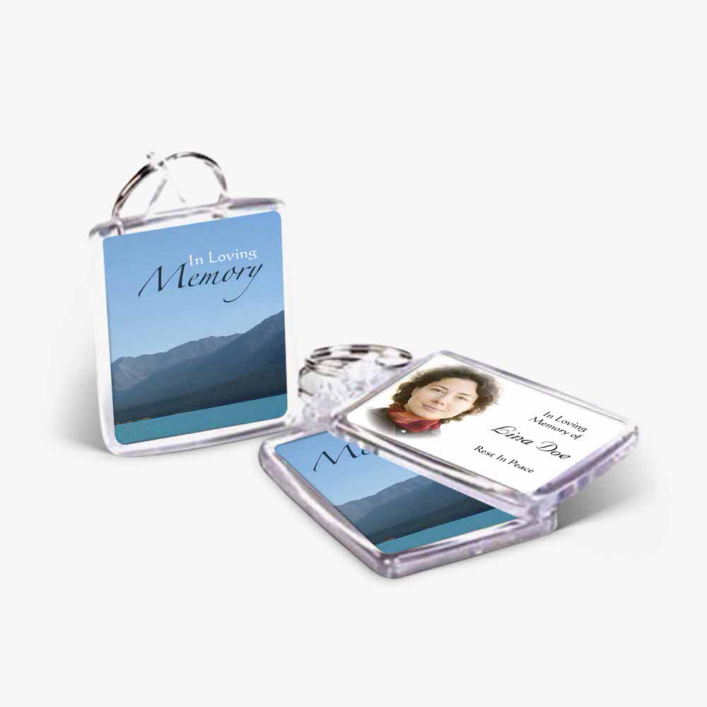 a memory keyring with a photo of a mountain