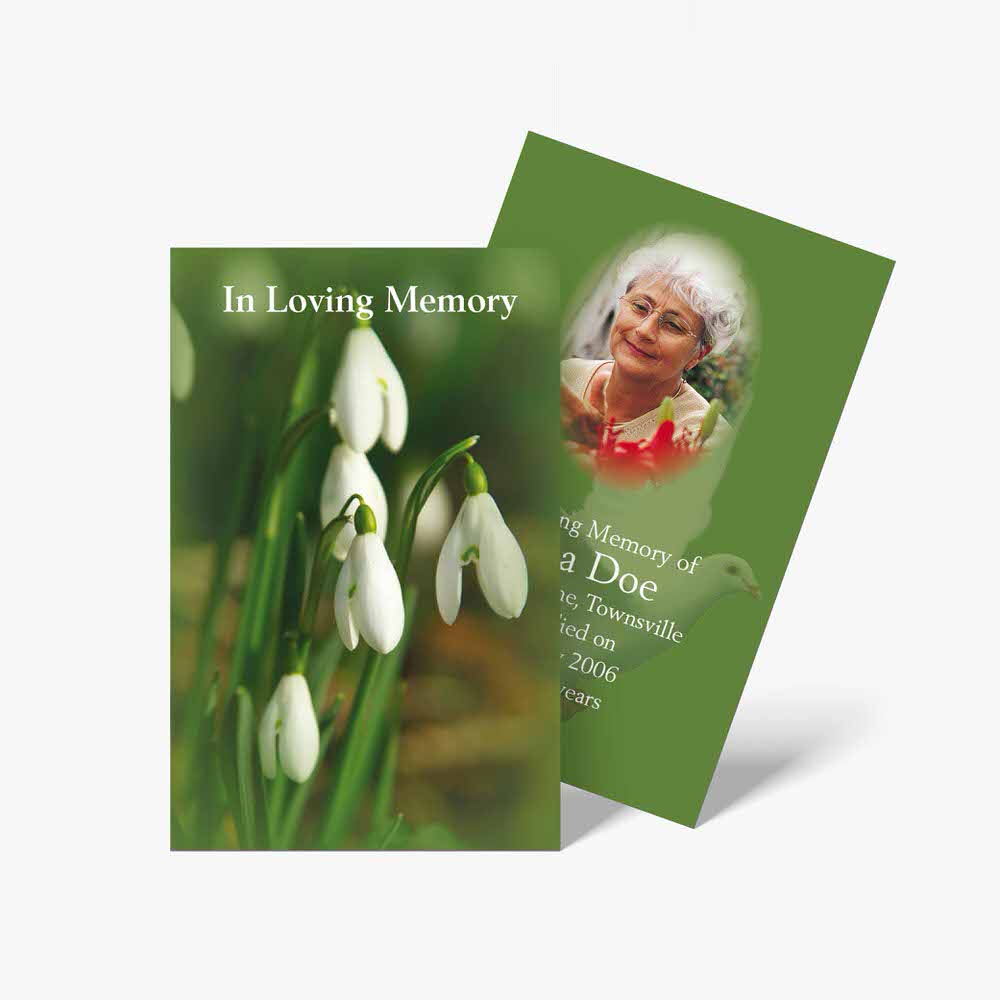 a funeral card with snowdrops and a photo of the person