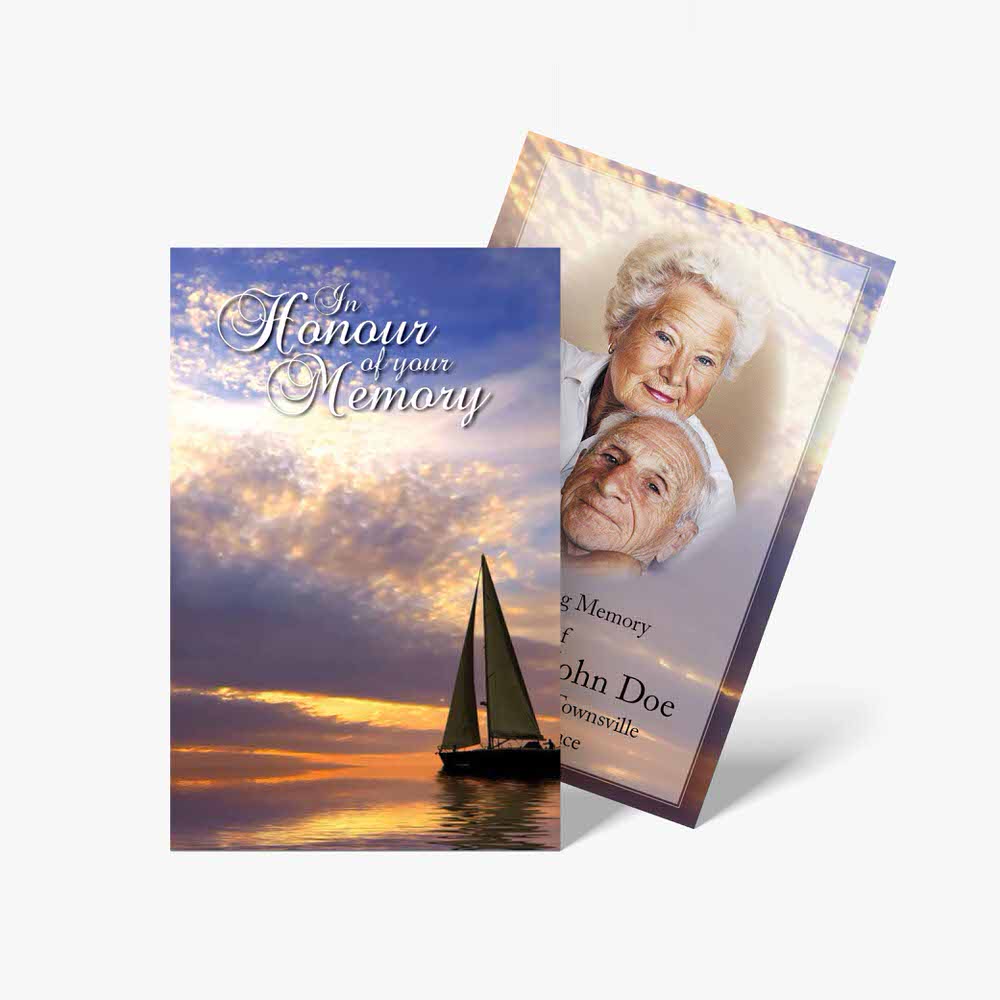 a funeral card with a sailboat and sunset