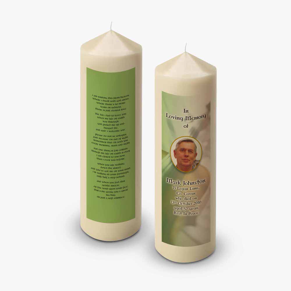 a candle with a picture of a man on it