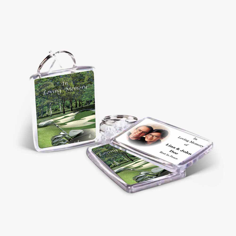 a clear plastic keychain with a photo of a golf course