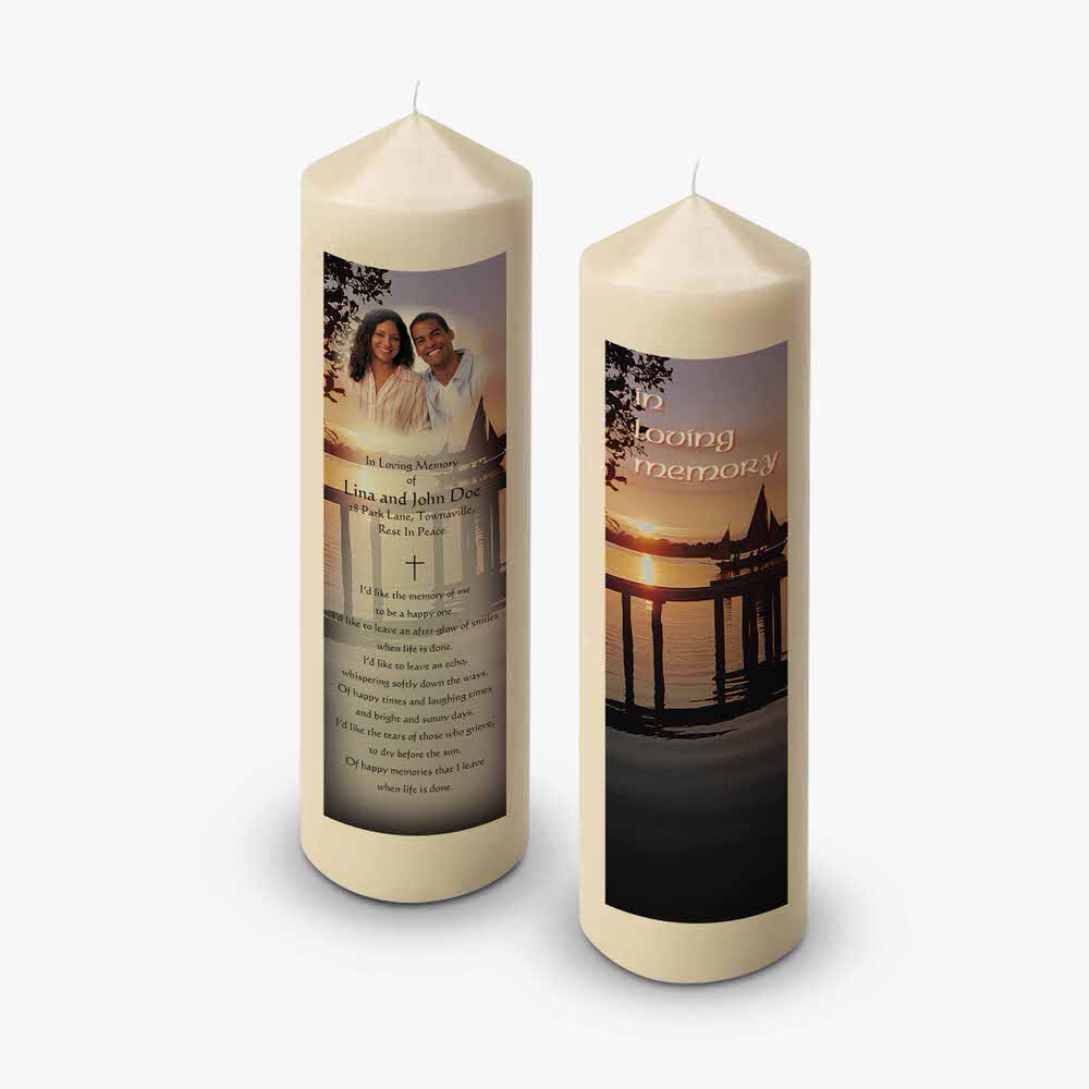 two candles with a photo of a couple on them