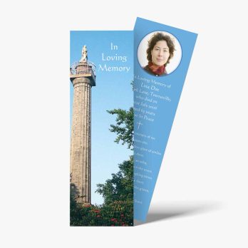 a bookmark with a photo of a monument and a quote