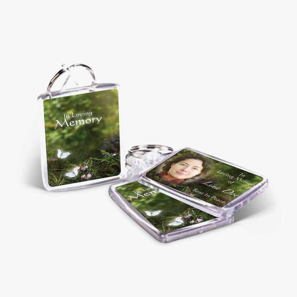 a photo keychain with a photo of a woman in the forest