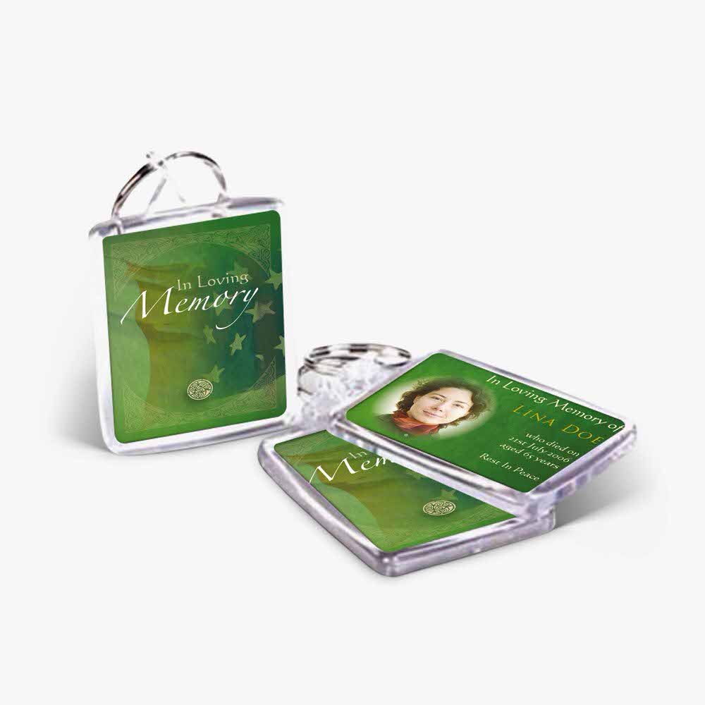 a green keychain with a photo of a woman
