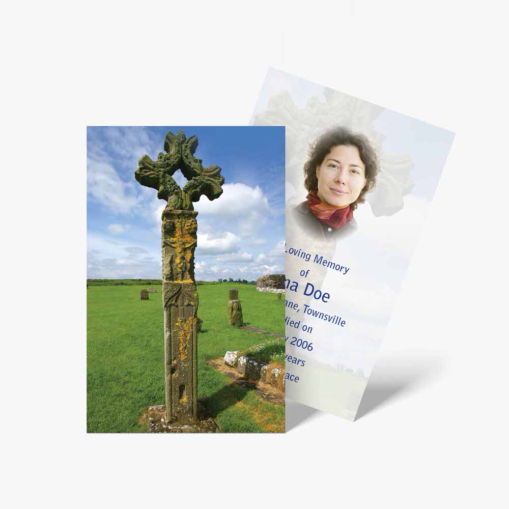 a funeral card with a photo of a woman in front of a cross