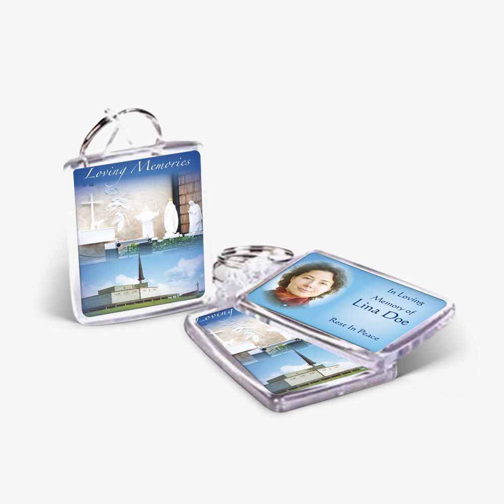 a key chain with a photo of a church and a photo of a woman