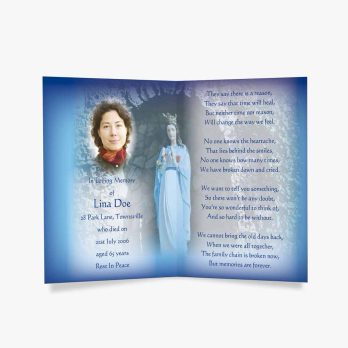 a blue prayer card with a picture of the virgin mary and the words