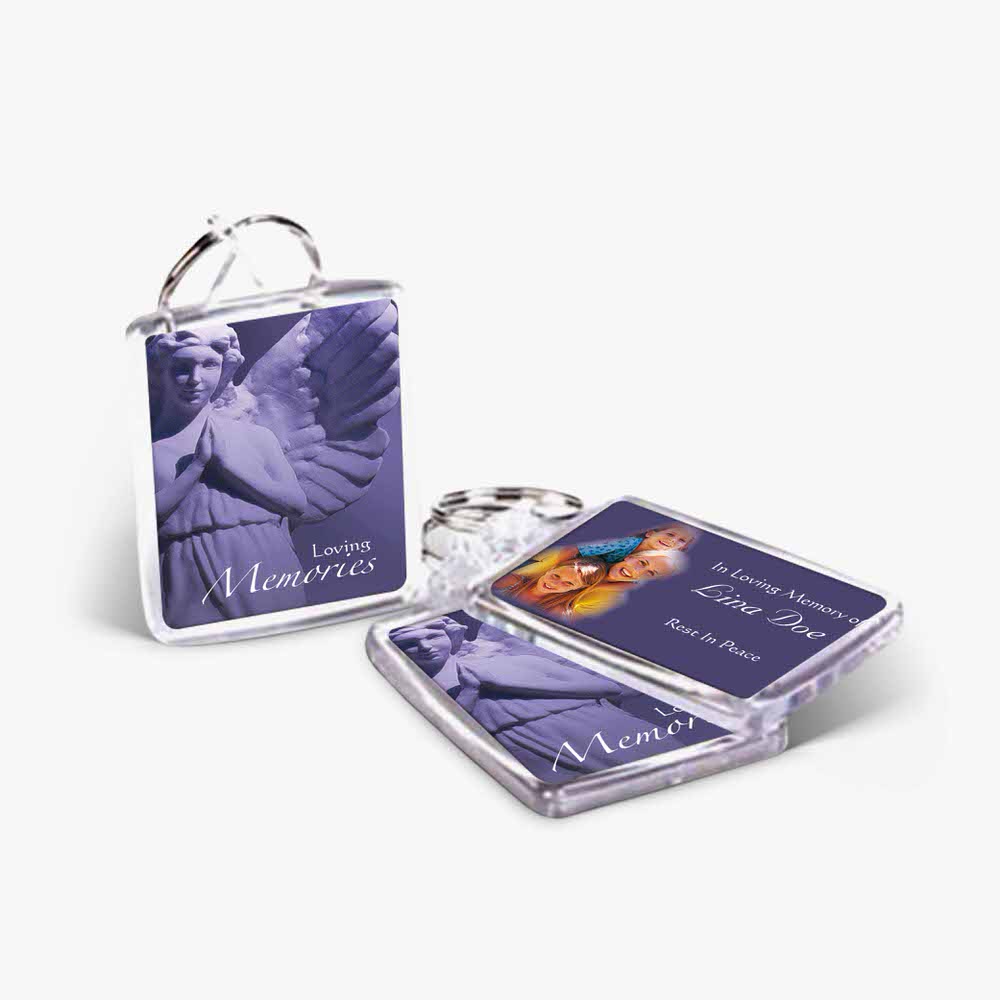 a key chain with a photo of an angel and a purple card
