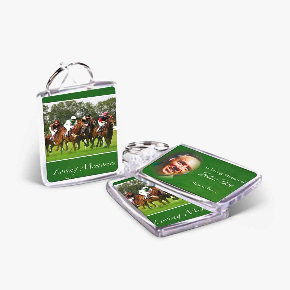 a green keychain with a photo of horses on it