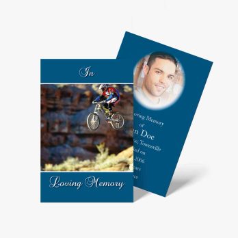 a blue and white photo card with a photo of a man on a bike