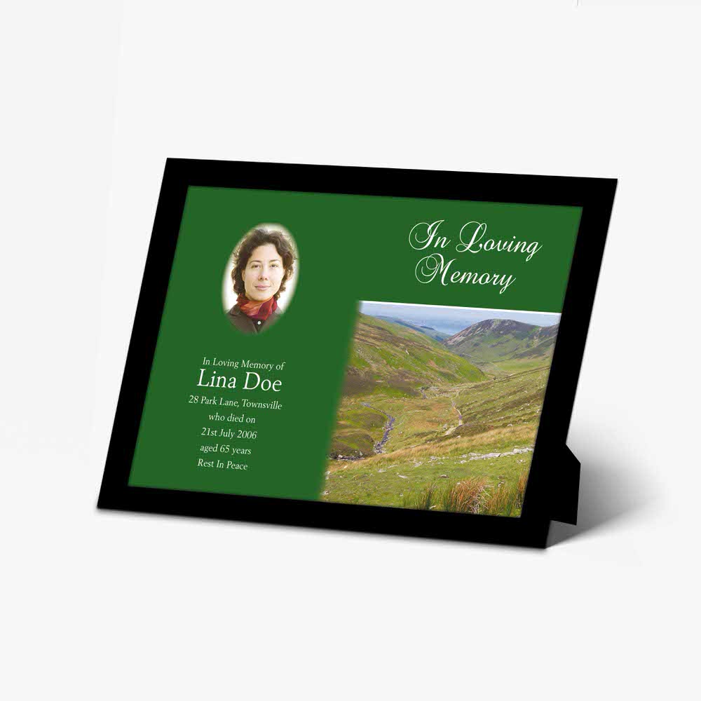 green & black photo frame with a photo of a woman in the mountains