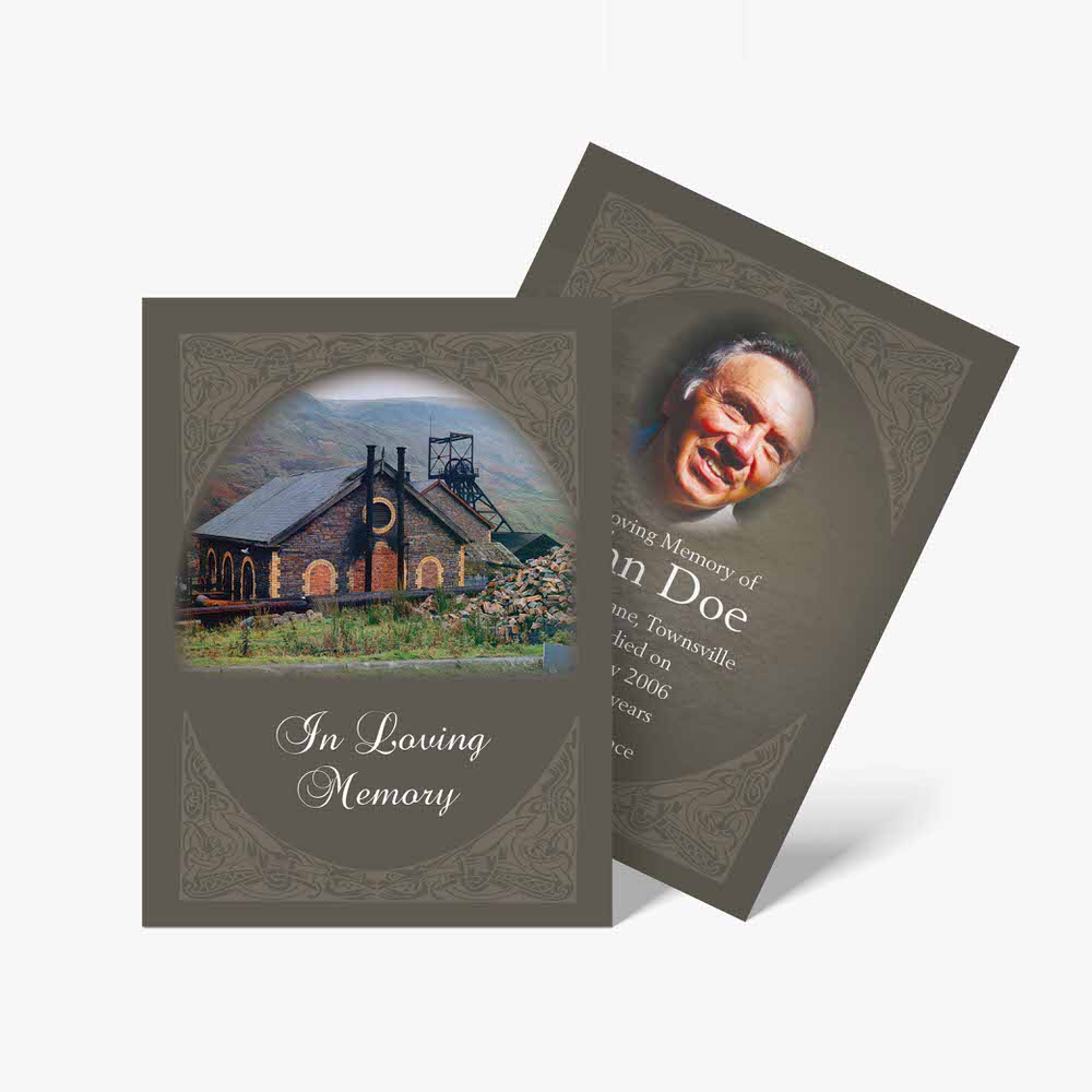 a funeral card with a photo of a house and a church