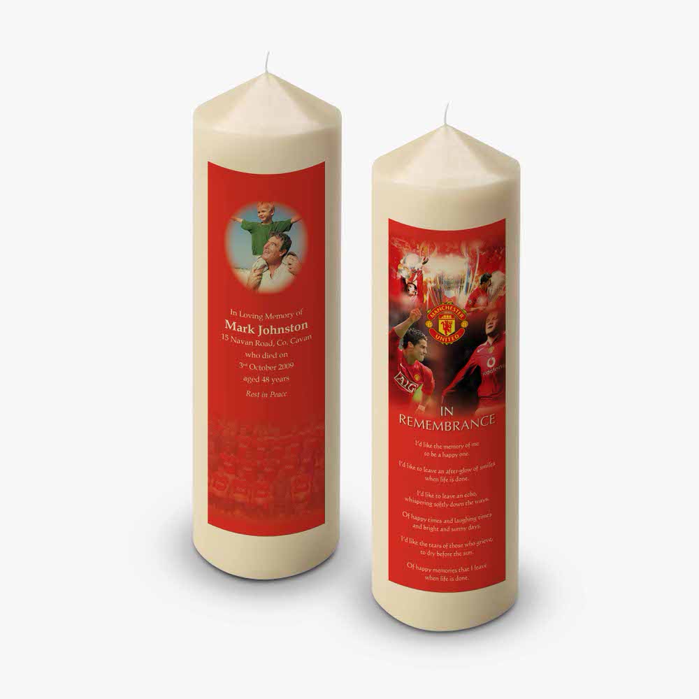 two candles with a red and white design