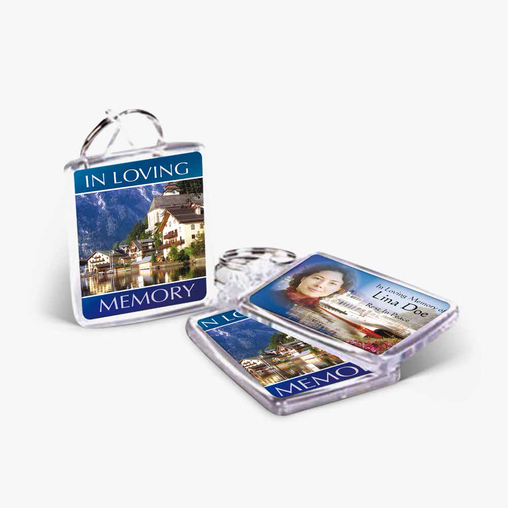 a keychain with a photo of a town and a keyring