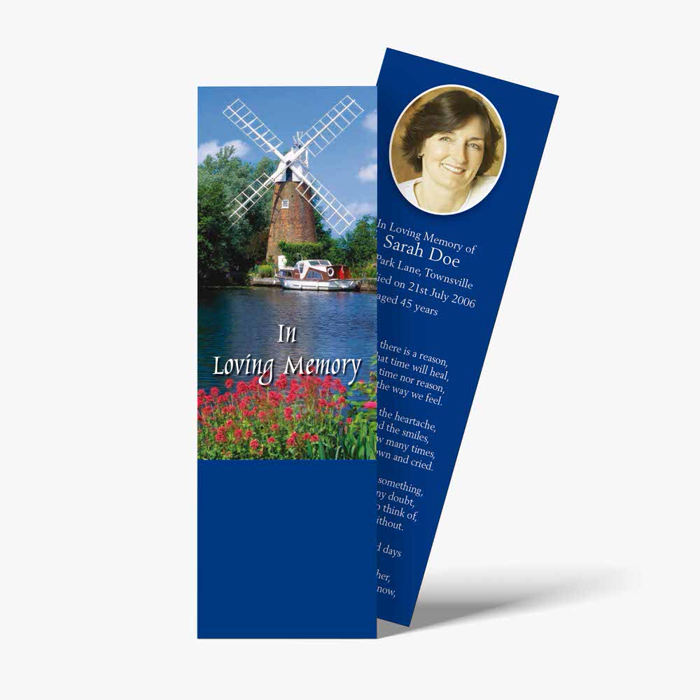 a bookmark with a windmill and flowers