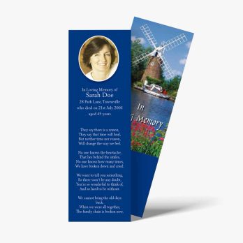 a bookmark with a windmill and a photo of a woman