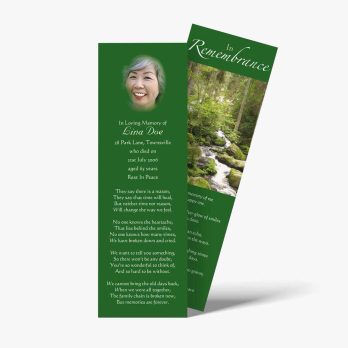 a green bookmark with a photo of a woman in a forest