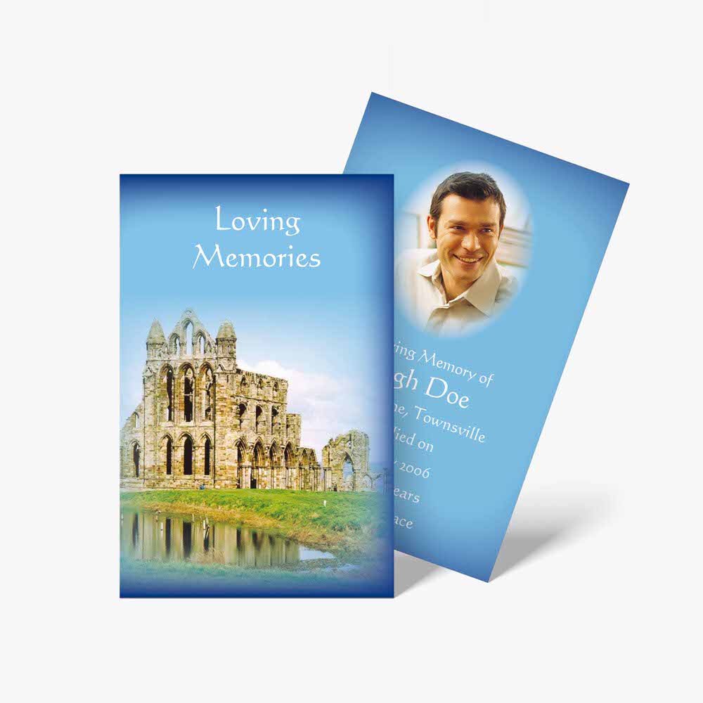 a funeral card with a photo of a castle