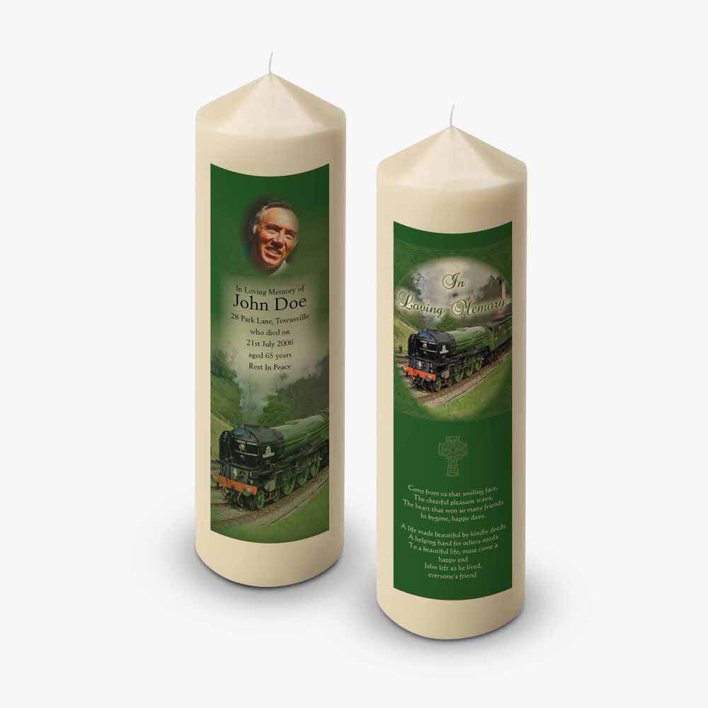 two candles with a picture of a train on them