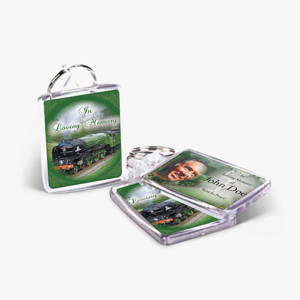 a keyring with a photo of a train and a picture of a person
