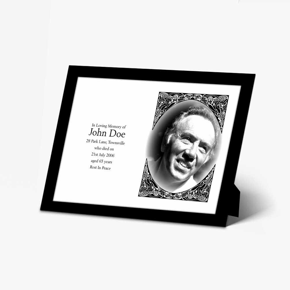 a memorial photo frame with a black and white photo of a man