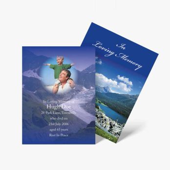 a blue and white funeral program with a photo of a mountain