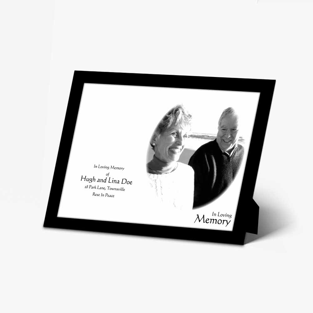 a black and white photo frame with a picture of a couple